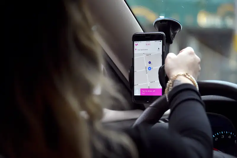 Lyft At Its San Francisco Headquarters Showcasing Lyft Cars, The Glowstache, The Lyft App, Lyft Passengers And Drivers