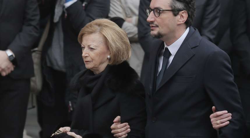 Maria Franca Ferrero, the widow of Michele Ferrero and his son Giovanni Ferrero arrive for the funeral of Michele Ferrero on Feb. 18, 2015 in Alba, northern Italy.