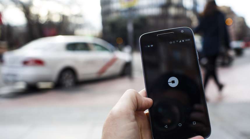 The Uber Technologies Inc. ride-hailing service smartphone app sits on a smartphone display.