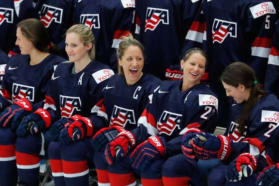 United States captain Meghan Duggan, laughs with Kacey Bellamy during a team photo in preparation for the IIHF Women's World Championship hockey tournament, Thursday, March 30, 2017, in Plymouth, Mich. (AP Photo/Paul Sancya)