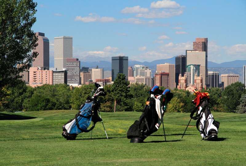City Park Golf Course with downtown skyline and Rocky Mountains behind, Denver, Colorado.