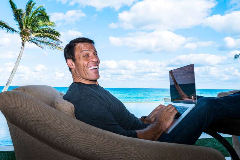 Robbins relaxing—and working—at home on his patio in West Palm Beach.