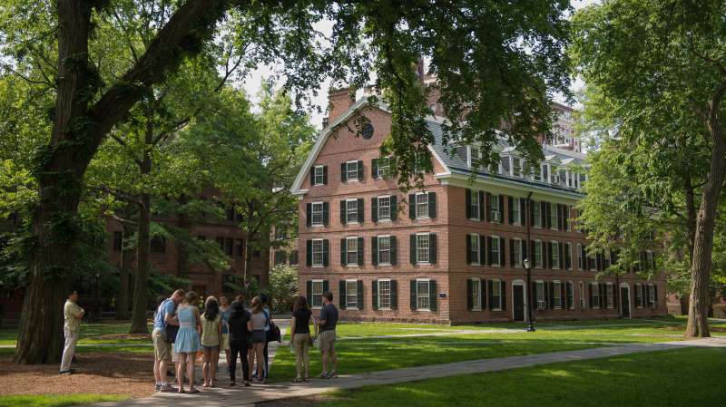 A tour group makes a stop at Connecticut Hall on the Yale University campus in New Haven, Connecticut, U.S., on Friday, June 12, 2015. Yale University is an educational institute that offers undergraduate degree programs in art, law, engineering, medicine, and nursing as well as graduate level programs.