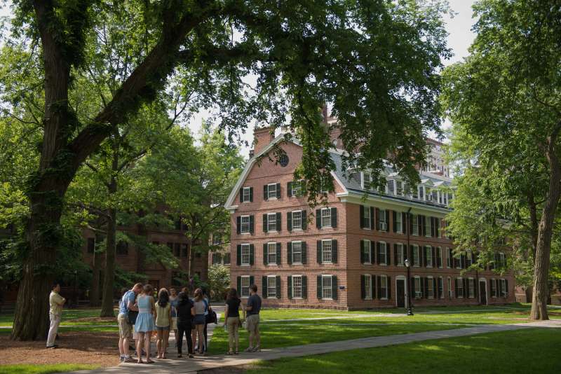 A tour group makes a stop at Connecticut Hall on the Yale University campus in New Haven, Connecticut, U.S., on Friday, June 12, 2015. Yale University is an educational institute that offers undergraduate degree programs in art, law, engineering, medicine, and nursing as well as graduate level programs.