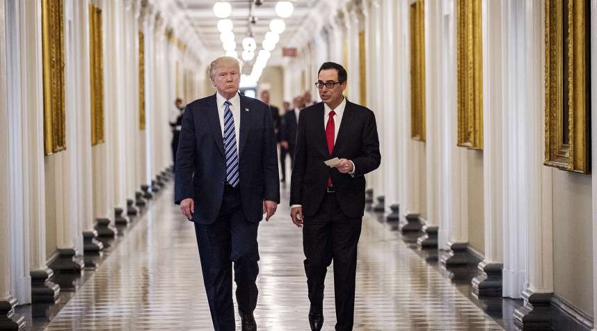 U.S. President Donald Trump, left, and Steven Mnuchin, U.S. Treasury secretary, walk down the hall of the Treasury Department building on April 21, 2017.