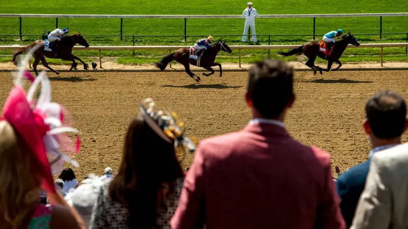 Fans watch an undercard race on Kentucky Derby Day on May 7, 2016 in Louisville, Kentucky.