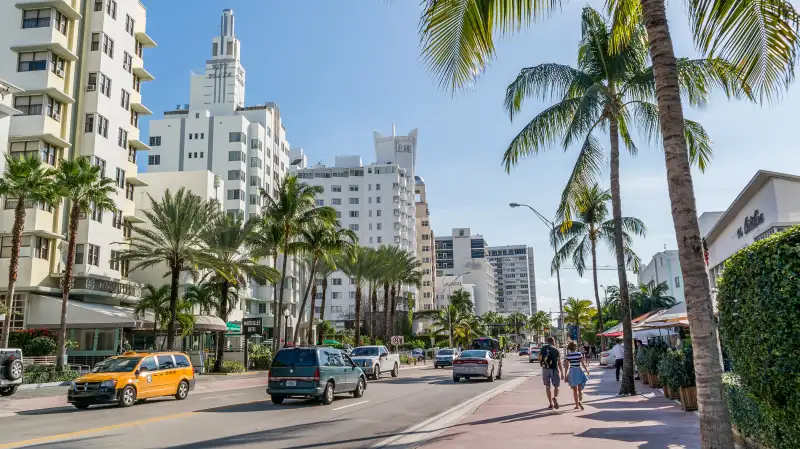 People and traffic on Collins Avenue in South Beach district of Miami Beach, Florida, December 9, 2015.