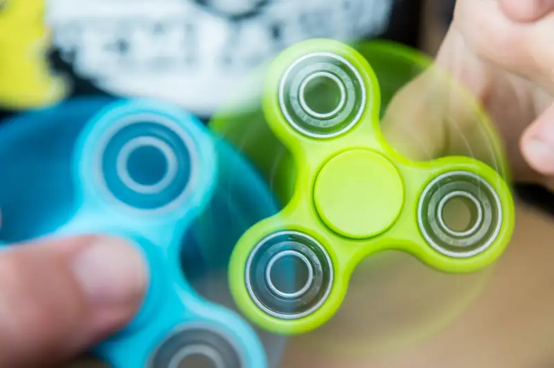 Sunday  30 April 2014 Pictured: Children using uses a fidget spinners