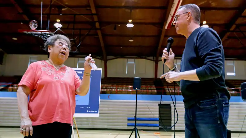 Rae Seaton challenges U.S. Rep. Rod Blum, R-Iowa, on his answer to her healthcare question during a town hall at Dubuque Senior High School in Dubuque, Iowa, on Monday, May 8, 2017.