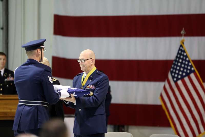 Brig. Gen. Brent Feick, outgoing director of joint staff for the Alaska National Guard, participates in a flag folding ceremony during his retirement ceremony at Joint Base Elmendorf-Richardson, Alaska, on April 1, 2017.