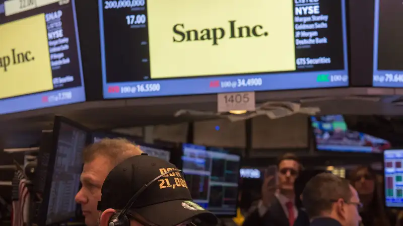 Traders work on the floor during the Snap Inc. IPO at the New York Stock Exchange, March 2, 2017, in New York.