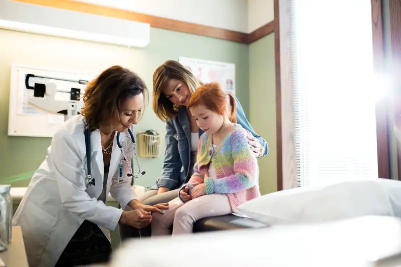 young girl getting checkup