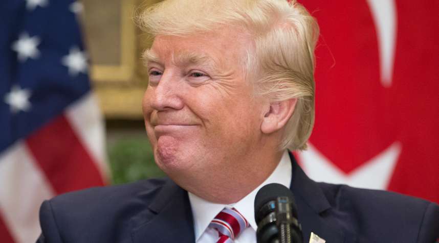 US President Donald Trump smiles during a joint statement with President of Turkey Recep Tayyip Erdogan (not pictured) in the Roosevelt Room of the White House on May 16, 2017 in Washington, DC.