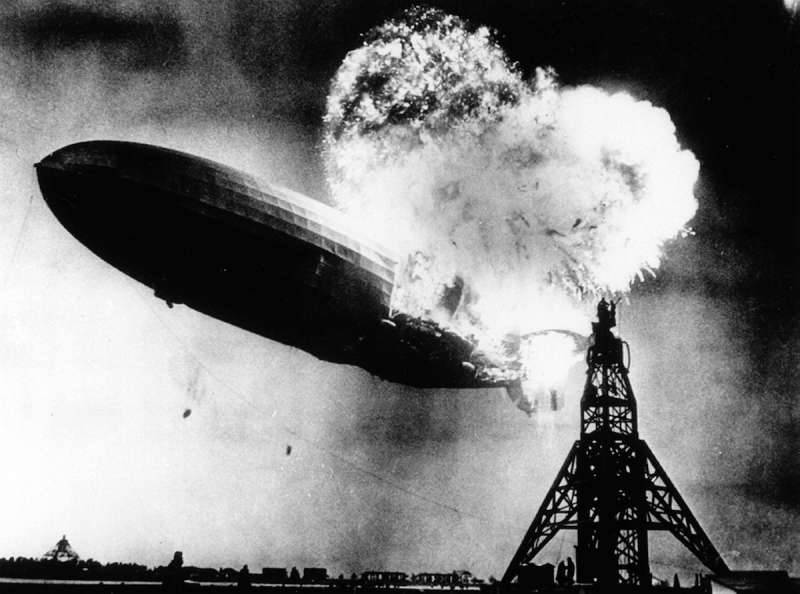 The Hindenburg, a large German commercial passenger-carrying rigid airship, destroyed by fire.
