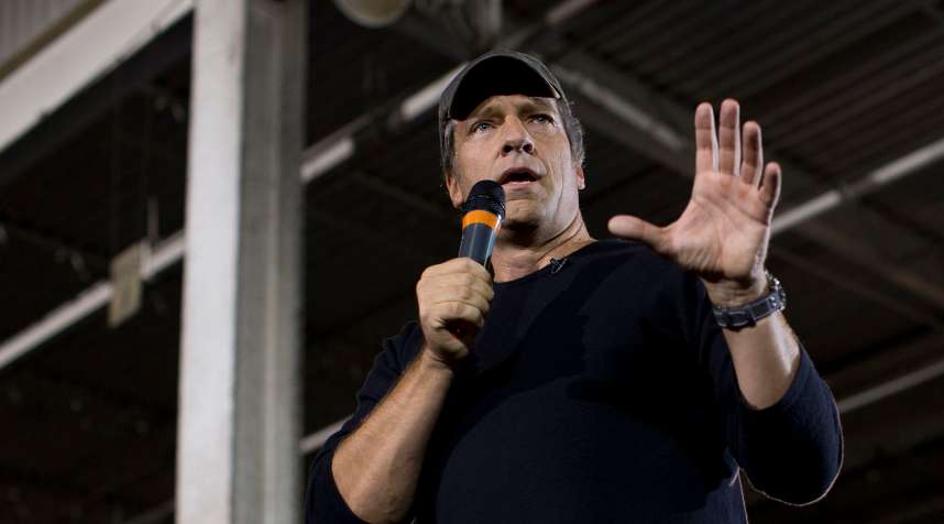 Mike Rowe, host of television show  Dirty Jobs  introduces Republican presidential candidate, former Massachusetts Gov. Mitt Romney, right, during a campaign stop at American Spring Wire, Sept. 26, 2012, in Bedford Heights, Ohio.