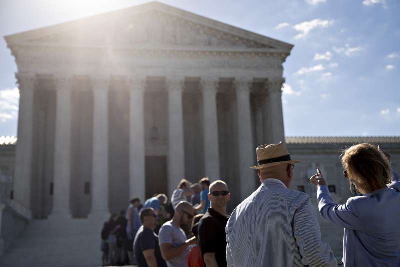 Visitors wait to enter the U.S. Supreme Court in Washington, D.C., U.S., on Monday, June 26, 2017. The U.S. Supreme Court is letting the Trump Administration enforce  its 90-day ban on travelers from six mostly Muslim countries.