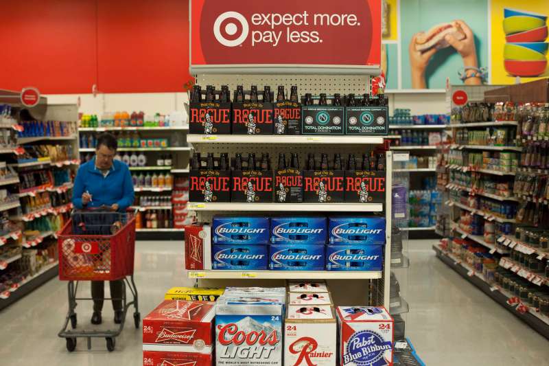 Beer is displayed for sale as a customer shops at a Target Corp. store in Seattle, Washington, U.S., on Thursday, May 14, 2015. Target Corp. is scheduled to release earnings figures on May 20. Photographer: David Ryder/Bloomberg via Getty Images