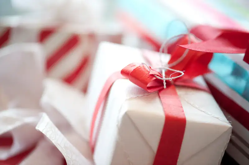 Gift-wrapped Christmas presents with red bow