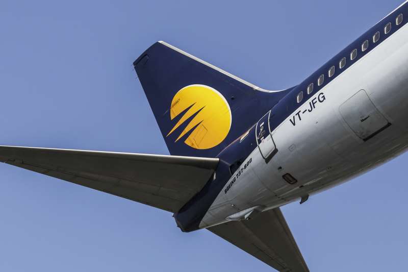 The livery of an aircraft operated by Jet Airways India Ltd. is seen on the tail fin as the plane prepares to land at Chhatrapati Shivaji International Airport in Mumbai, India, on Monday, Nov. 7, 2016. Jet Airways, part-owned by Etihad Airways PJSC, is scheduled to announce second-quarter earnings figures on Nov. 11. Photographer: Dhiraj Singh/Bloomberg via Getty Images