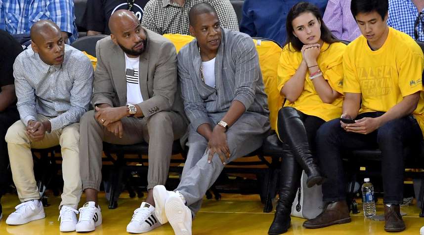 Recording artist Jay-Z (center) attends Game 1 of the 2017 NBA Finals in Oakland, Calif.