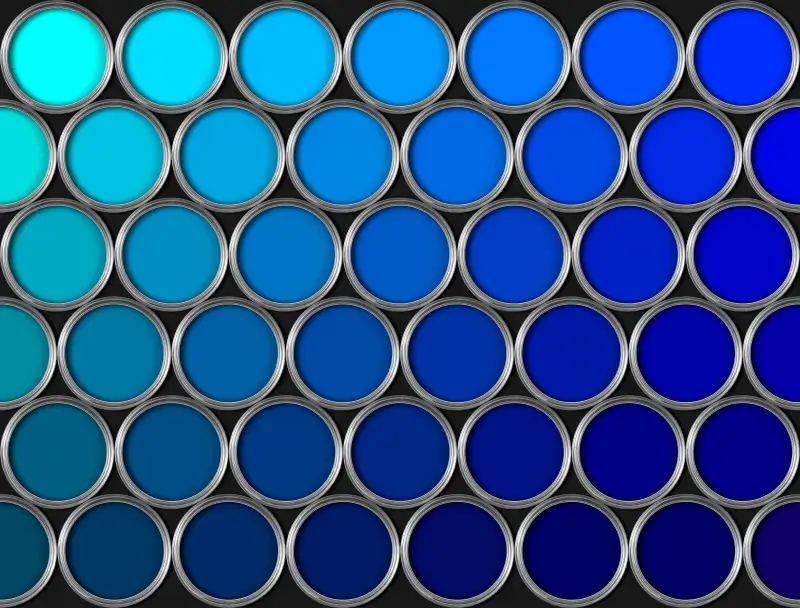 Tins of blue paint in rows on black background