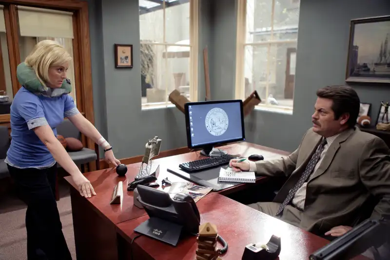 PARKS AND RECREATION -- Pilot -- Pictured: Amy Poehler as Leslie Knope, Nick Offerman as Ron Swanson -- NBC Photo: Mitch Haddad