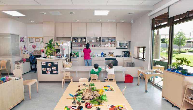 Interior view of preschool classroom and kitchen