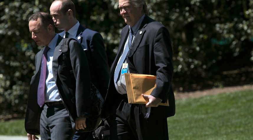 White House Chief of Staff Reince Priebus (L), chief political strategist Steve Bannon (R), and senior policital advisor Stephen Miller (C) walk to a waiting Marine One helicopter while departing the White House with U.S. President Donald Trump April 18, 2017 in Washington, DC.