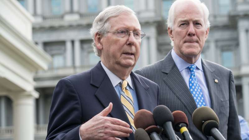 US Senate Majority Leader Mitch McConnell (L) and Majority Whip John Cornyn speak to the press outside the West Wing of the White House after Republican senators met with US President Donald Trump to discuss the healthcare bill in Washington, DC, on June 27, 2017.