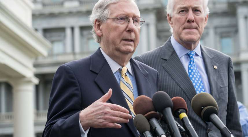 US Senate Majority Leader Mitch McConnell (L) and Majority Whip John Cornyn speak to the press outside the West Wing of the White House in June, after Republican senators met with US President Donald Trump to discuss the healthcare bill.