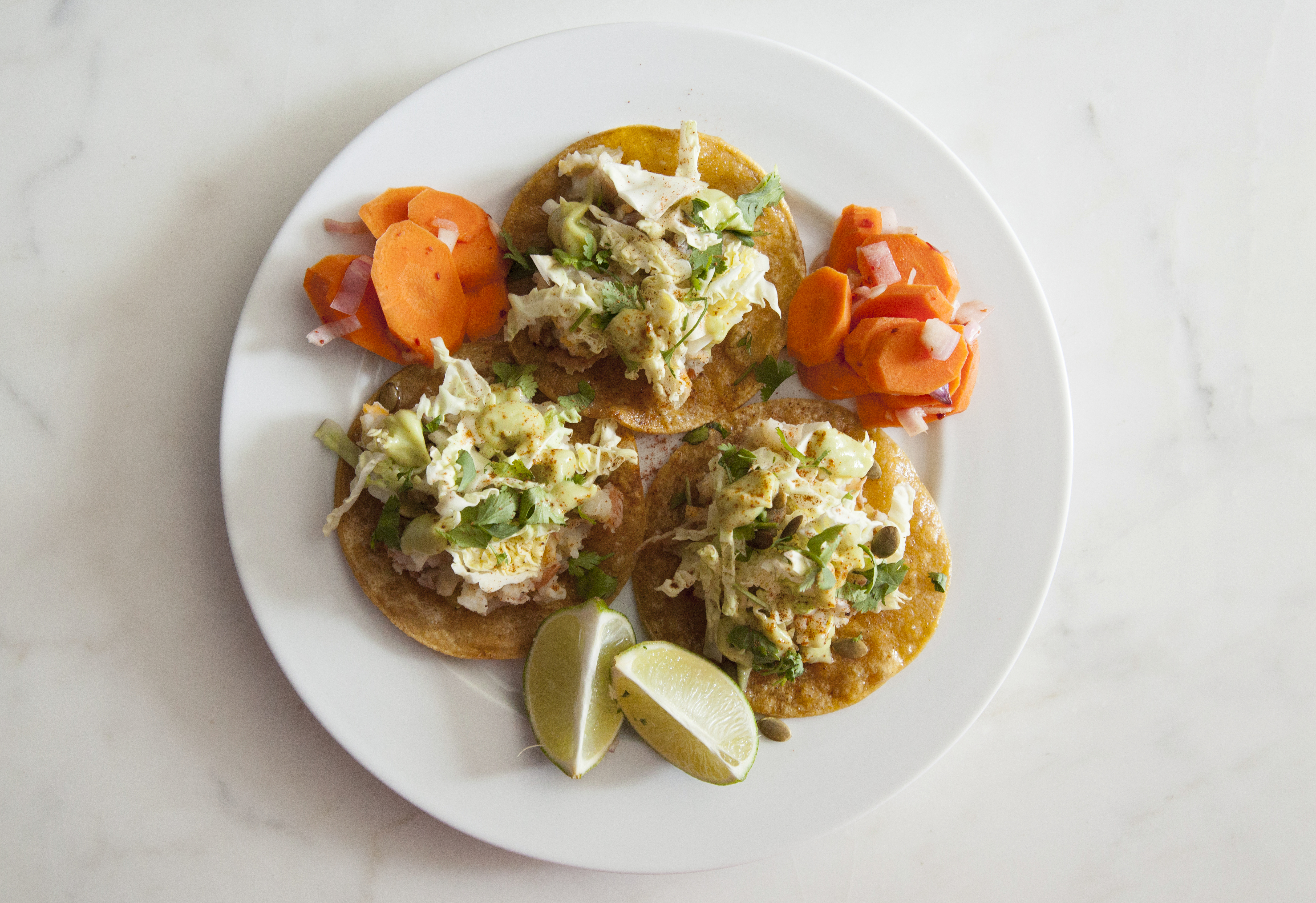 Sun Basket's Tex-Mex tostadas with pickled carrots and avocado crema.