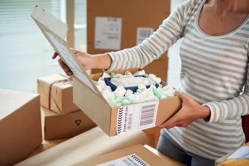 woman opening package