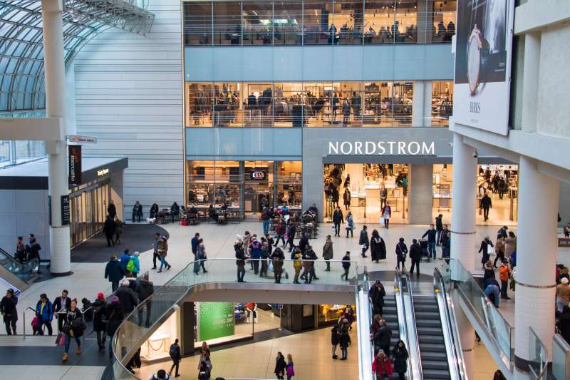 Busy multi-storey mall Eaton Centre Center. Nordstrom store