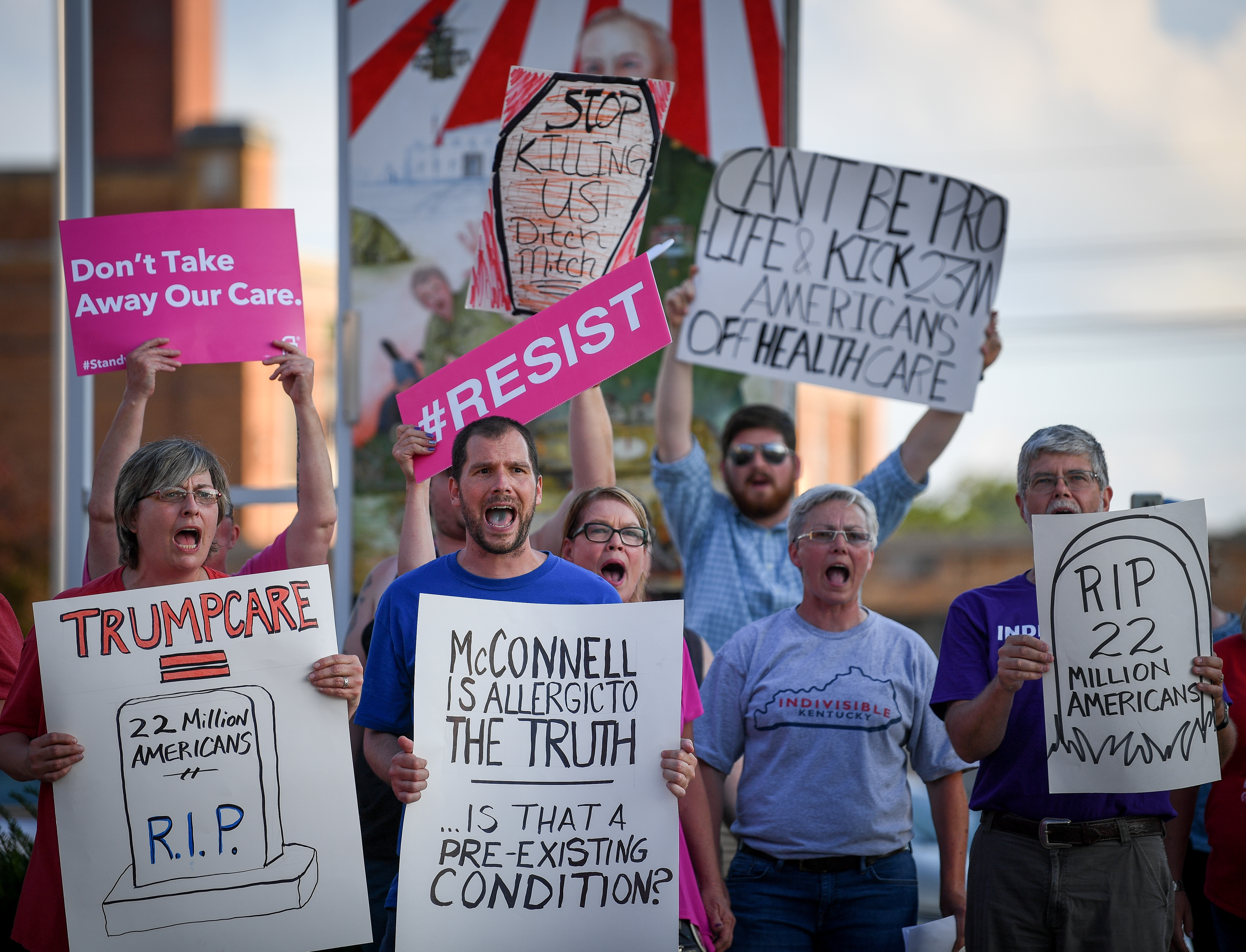 Protesters rally outside a Harden County Republican party fundraiser where Senate Majority Leader McConnell is scheduled to speak in Elizabethtown