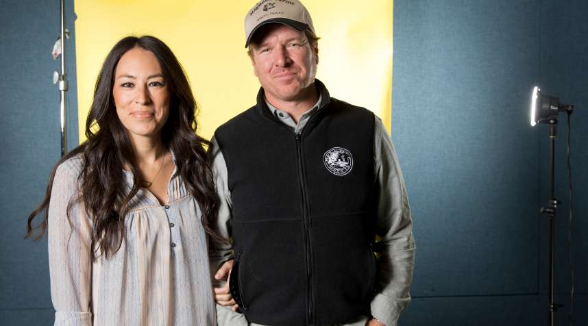In this March 29, 2016 photo, Joanna Gaines, left, and Chip Gaines pose for a portrait in New York to promote their home improvement show,  Fixer Upper,  on HGTV.