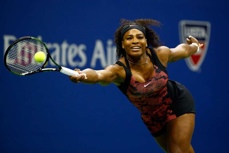 Serena Williams of the United States returns a shot against Venus Williams of the United States during their Women's Singles Quarterfinals match on Day Nine of the 2015 US Open at the USTA Billie Jean King National Tennis Center on September 8, 2015 in the Flushing neighborhood of the Queens borough of New York City.