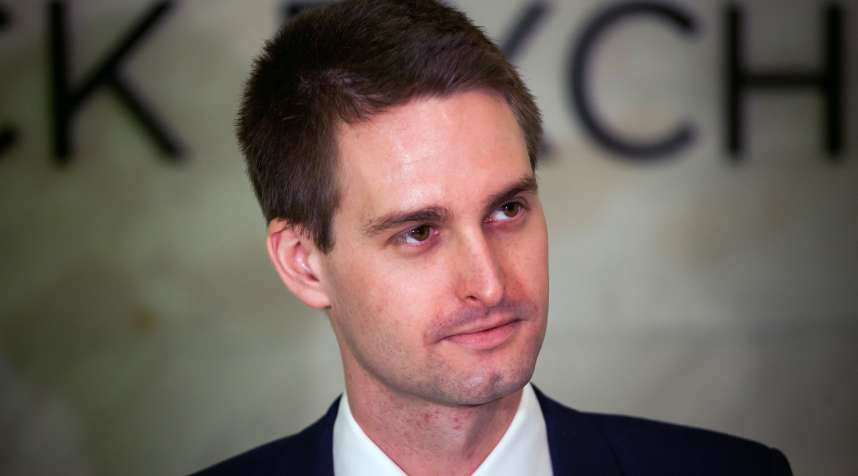 Evan Spiegel, co-founder and chief executive officer of Snap Inc., stands on the floor of the New York Stock Exchange (NYSE) during the company's initial public offering (IPO) on March 2, 2017.