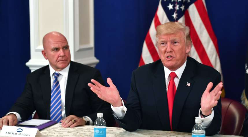 US President Donald Trump, with National Security Advisor H. R. McMaster, speaks during a security briefing on August 10, 2017, at his Bedminster National Golf Club in New Jersey.