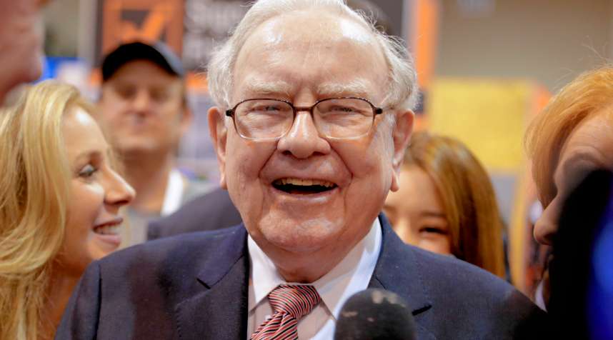 Berkshire Hathaway Chairman and CEO Warren Buffett laughs while touring the exhibit floor at the CenturyLink Center in Omaha, Neb., Saturday, May 6, 2017, where company subsidiaries display their products.