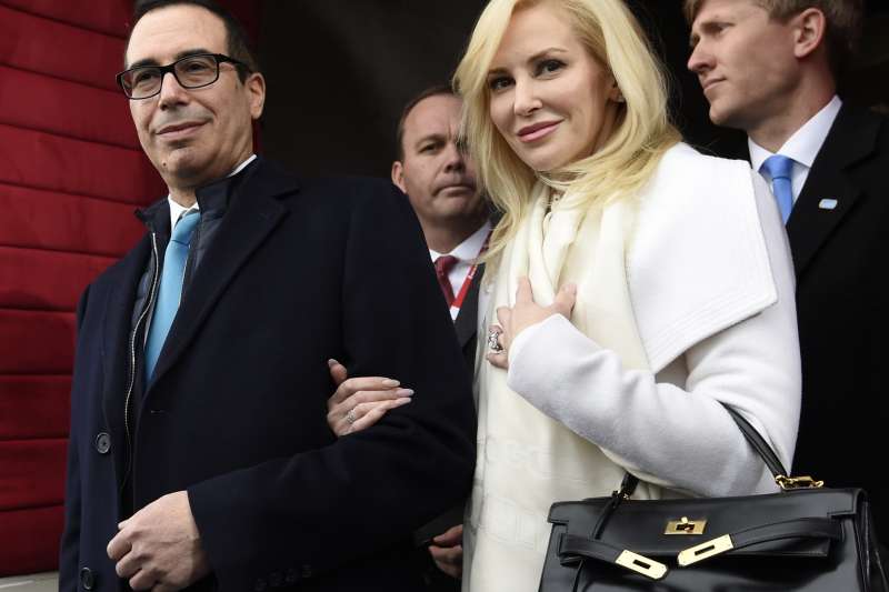 In this Friday, Jan. 20, 2017, file photo, Treasury Secretary-designate Stephen Mnuchin and his then-fiancee, Louise Linton, arrive on Capitol Hill in Washington, for the presidential inauguration of Donald Trump.
