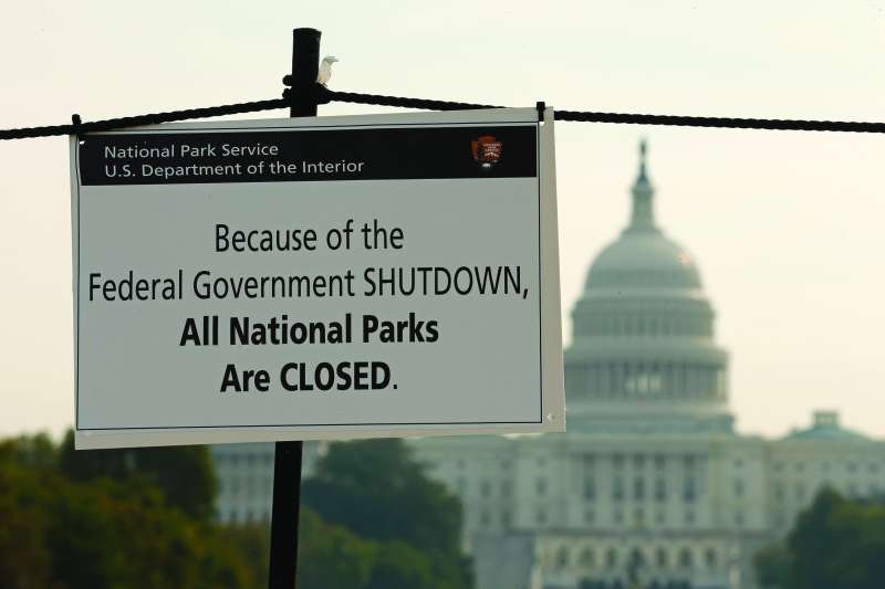 The U.S. Capitol looms in the background of a sign on the National Mall reminding visitors of the closures to all national parks due to the federal government shutdown in Washington October 3, 2013.