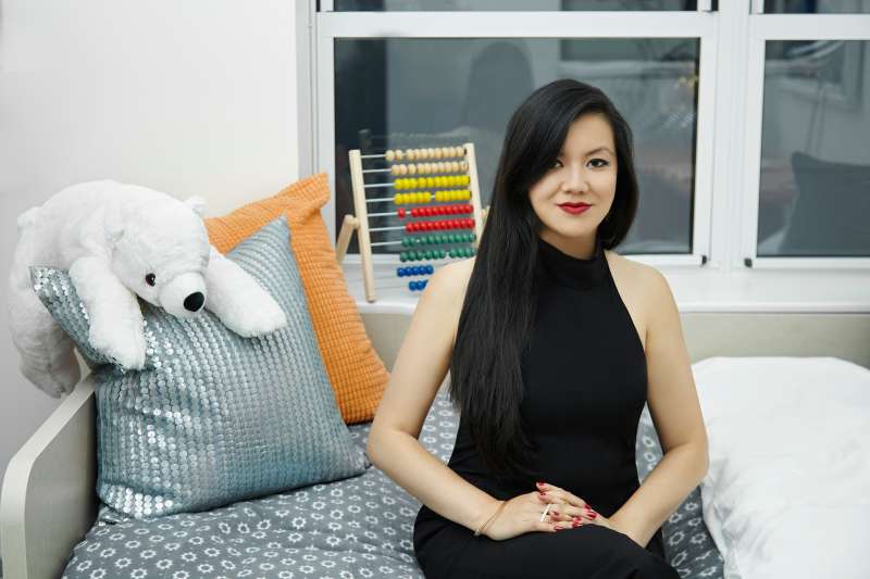 Mogul CEO Tiffany Pham sitting on a couch.