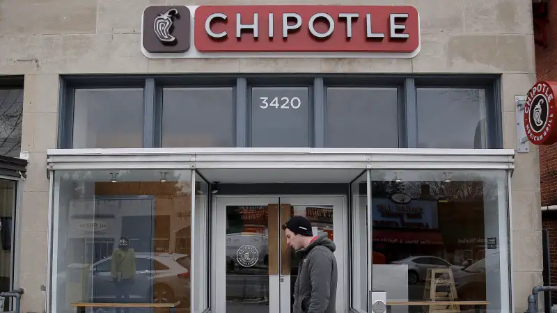 A man walks by a Chipotle Mexican Grill in Washington, February 8, 2016.