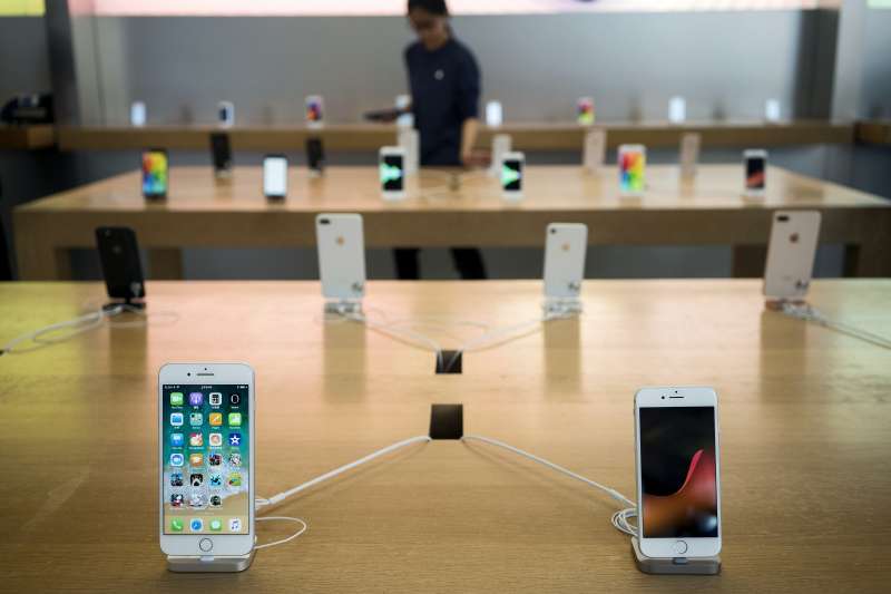 An Apple Inc. iPhone 8 Plus, left, and iPhone 8 stand on display at the Apple Store at Sanlitun during the launch of the devices in Beijing, on September 22, 2017.