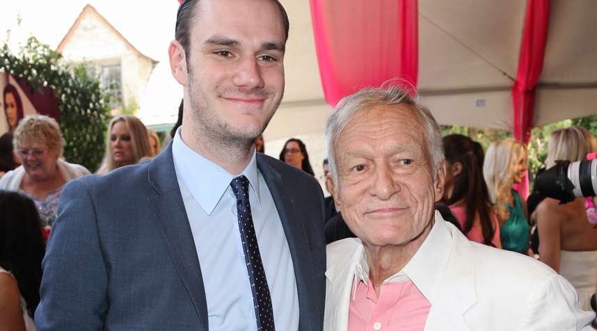 Playboy Founder Hugh Hefner and and his son Cooper Hefner attend the 2013 Playmate Of The Year announcement at The Playboy Mansion on May 9, 2013 in Beverly Hills, Calif.