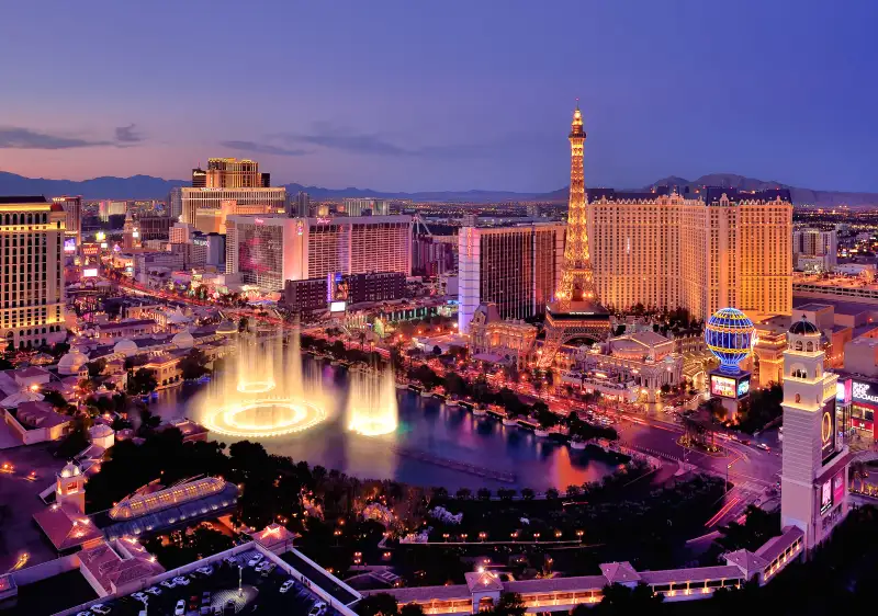 City skyline at night with Bellagio Hotel water fountains, Las Vegas.