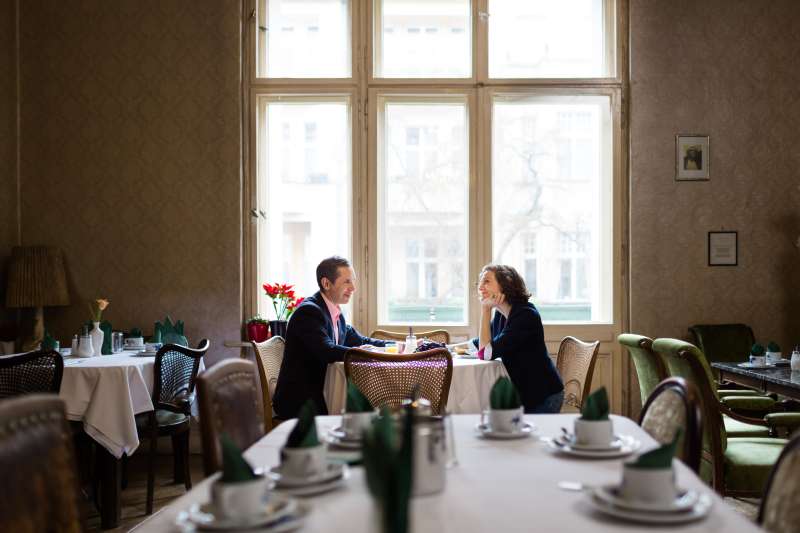 Mature couple having breakfast in an old hotel