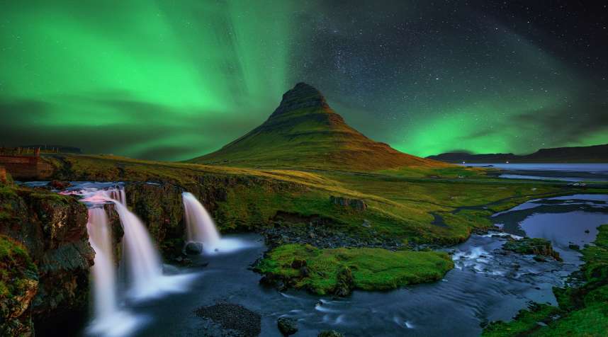 The northern lights above Kirkjufell (a.k.a.  church mountain ) in Iceland.