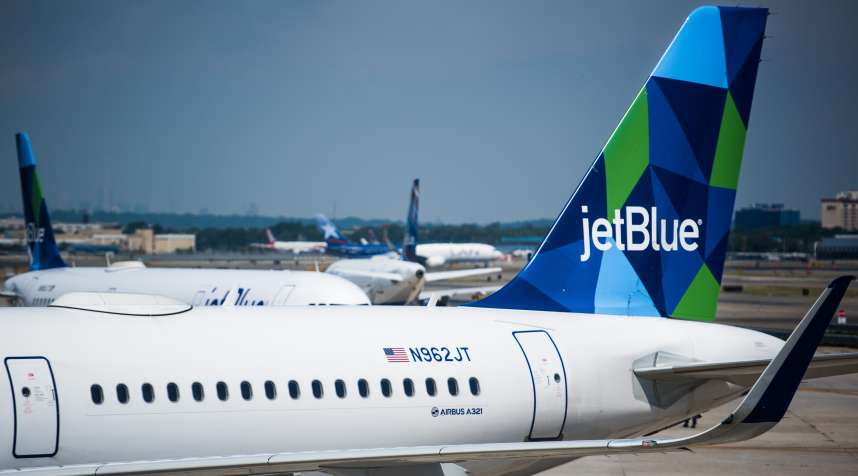 A JetBlue Airways Corp. Airbus A321 plane sits at a gate outside of Terminal 5 at John F. Kennedy International Airport (JFK) in New York on July 12, 2017.