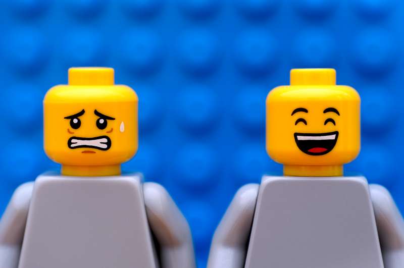 Two Lego minifigures - scared and happy